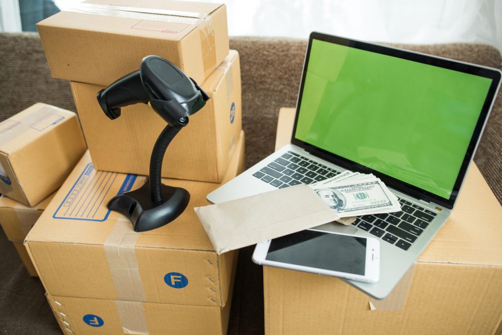 A box and computer with a handheld RFID scanner