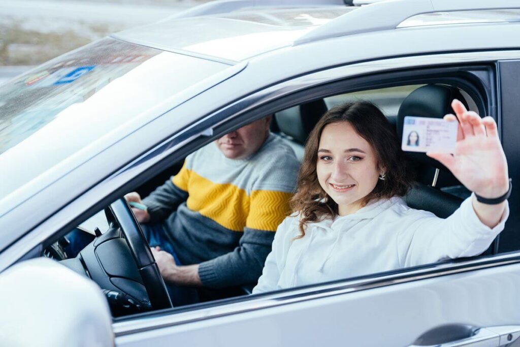 Vehicle passenger presenting an identification card before receiving parking access
