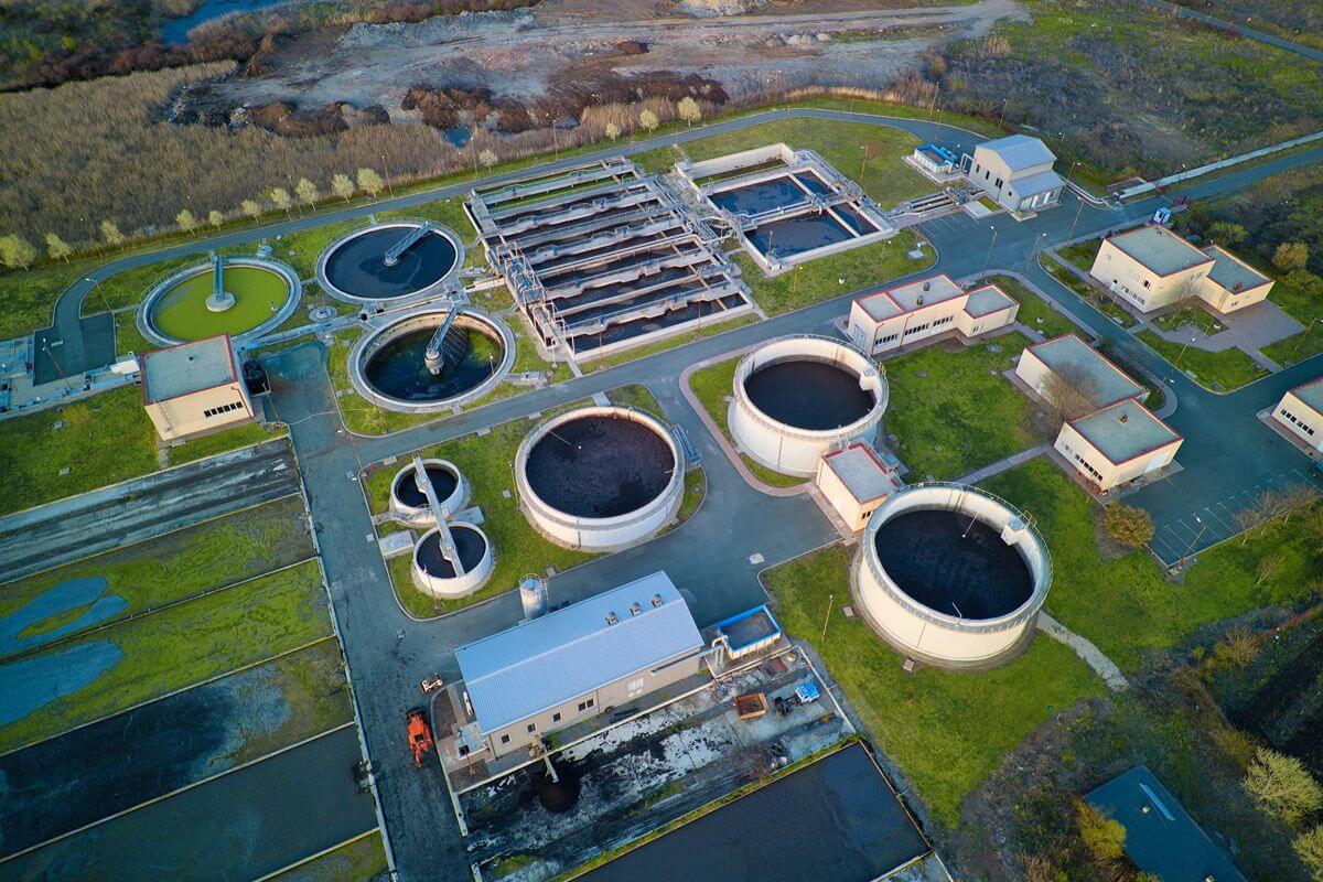 Aerial view of a large multi-site industrial facility with several operational buildings and work areas